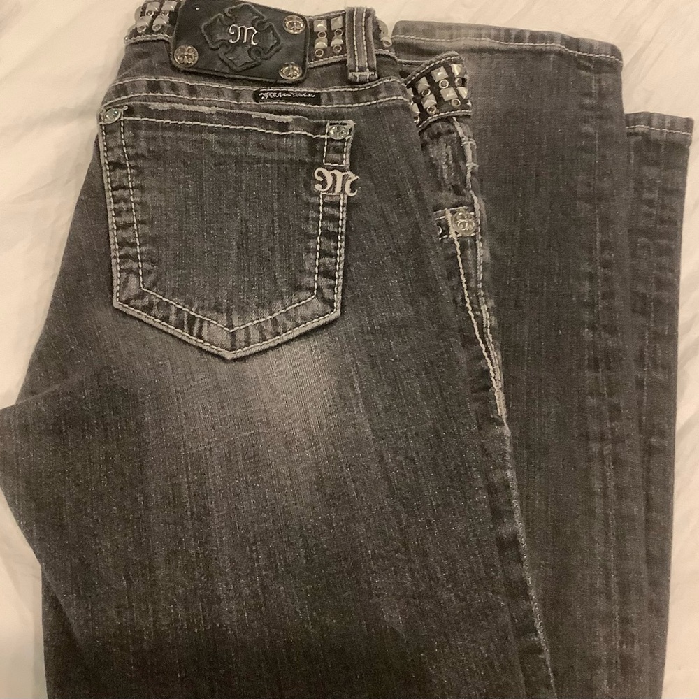 Embellished Miss Me acid wash dark grey jeans.